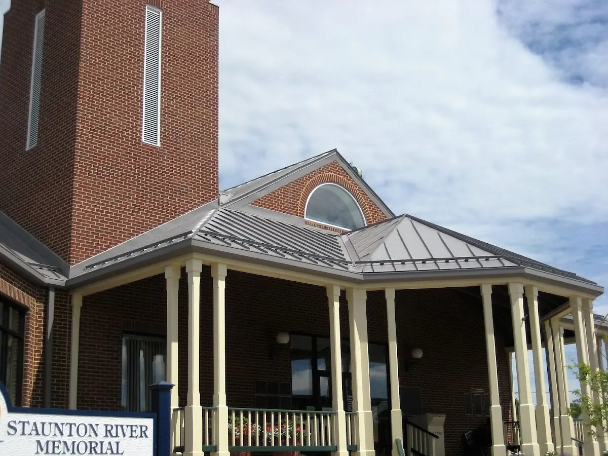 Skilled roofing craftsmen working on a residential roof in Liberty Center